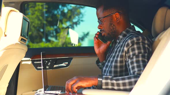 Handsome Successful Rich African American Businessmen in a Stylish Suit and Sitting in a Luxury Car