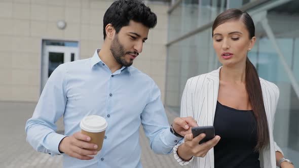 Business People Going To Work With Phone And Coffee On Street