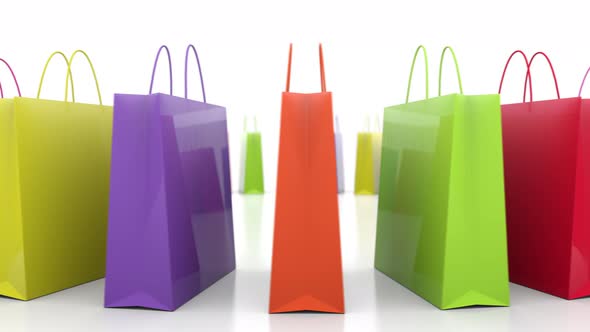 Multicolored Consumer Shopping Bags Rotating Isolated on the White Background