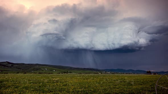 Time lapse of clouds rolling in rain storm over Wyoming landscape