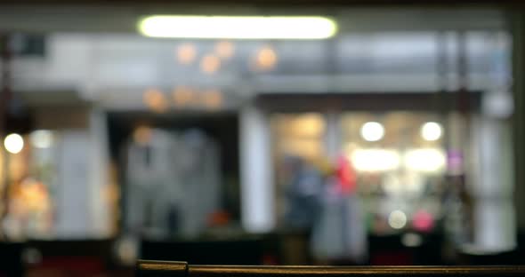 Defocused view of city street through the cafe window