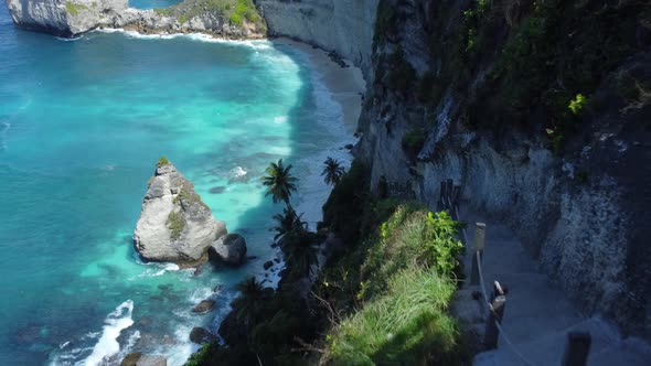 Drone Fly Over Girls on Stairs on Bounty Beach