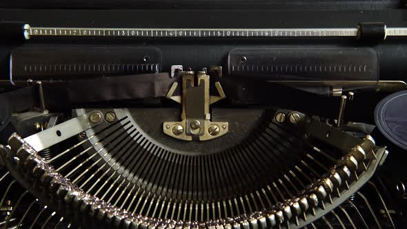 Details of an old retro typewriter, vintage style. Old typewriter hammers. Close up.