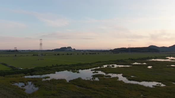 Beautiful Aerial Panoramic View of Canadian Mountain Landscape during a vibrant summer sunset. Taken