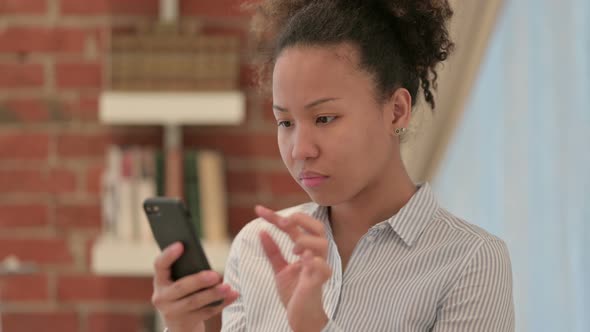 Portrait of African American Woman Using Smartphone