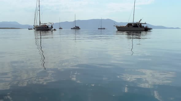 Aerial view of group of boats anchored in the mediterranean sea, Greece.