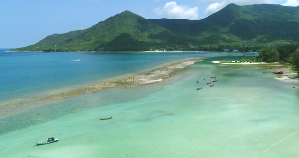 Thailand's Ocean Coast Aerial Boats and Ships on Shallow Water of Malibu Beach Chaloklum Bay