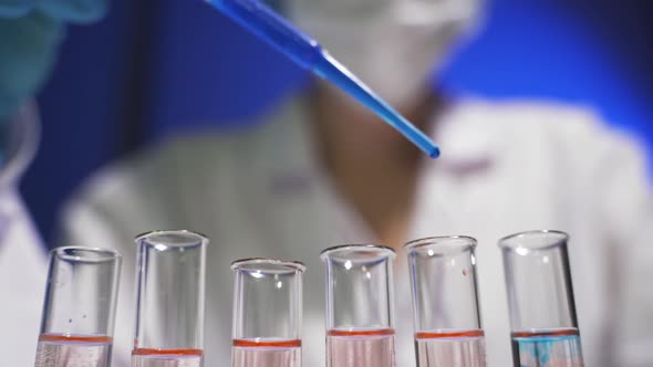 A Female Medical Scientist Works in a Laboratory