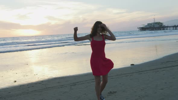 Girl spinning on the beach