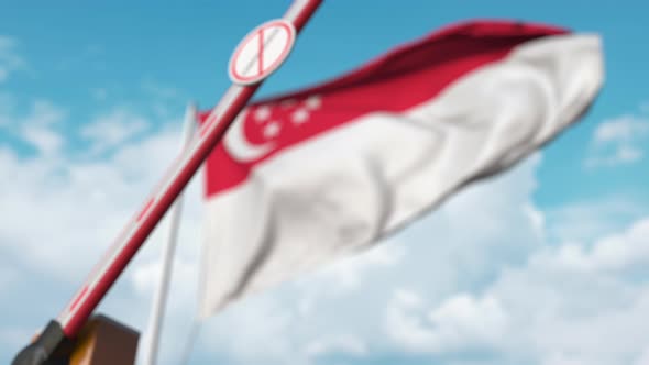 Barrier with STOP CORONAVIRUS Sign Closed at Flag of Singapore