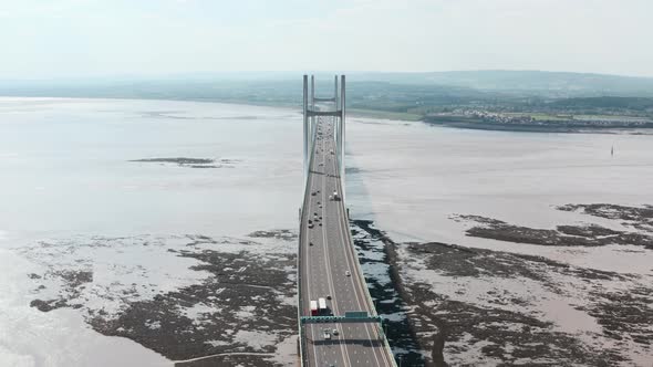Head on dolly back drone shot of Prince of wales Bridge Severn Estuary