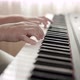 Close up of woman's hand playing on the electric piano. Female synthesizer player. - VideoHive Item for Sale