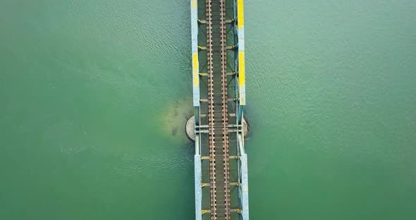 Steel Bridge with Train Tracks Over a River