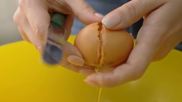 cooking the dessert - opening the egg with the knife - slow motion