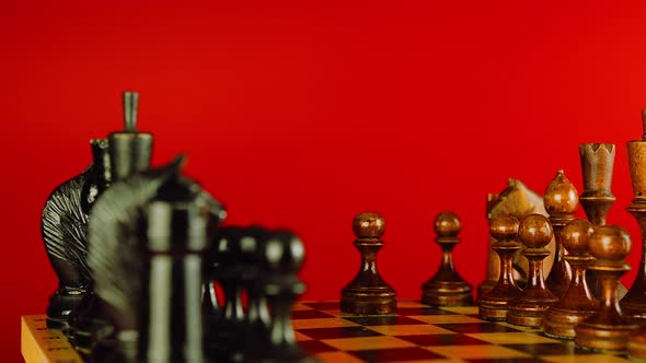 Close Up of White and Black Chess Pieces on Board