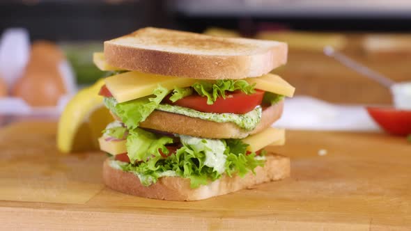 Sandwich with crusty bread toast and poached egg.