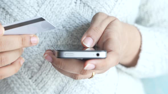  Women Hand Holding Credit Card and Using Smart Phone Shopping Online 