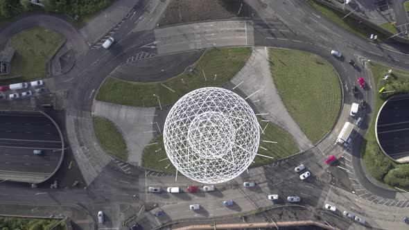 Aerial flyover of Belfast and the Rise Sculpture near the Falls Road and Westlink Motorway