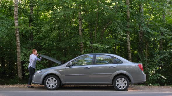 Side View of Confident Woman Opening Car Hood and Looking at Engine. 