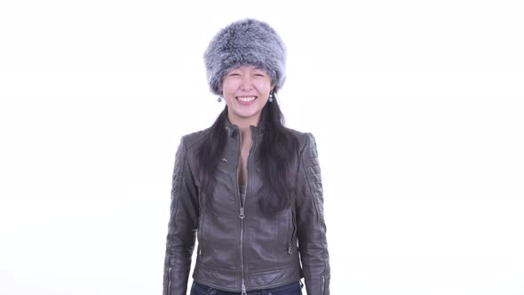 Happy Beautiful Asian Woman Smiling Ready for Winter