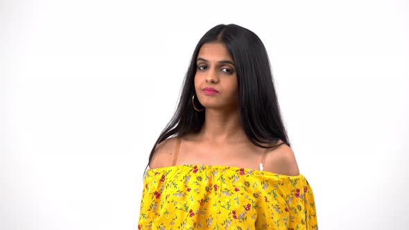 Uninterested Indian girl listening to someone