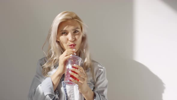 Caucasian Girl in Denim Jacket Posing in Studio