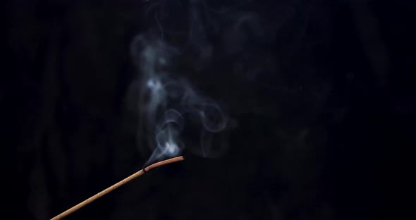 Incense Stick Burning Smoke Rising In Slow Motion