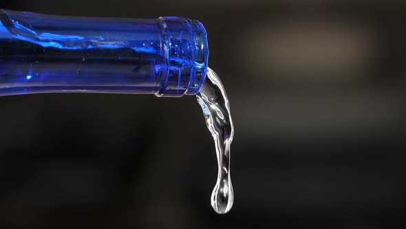 Water Pouring From a glass Bottle