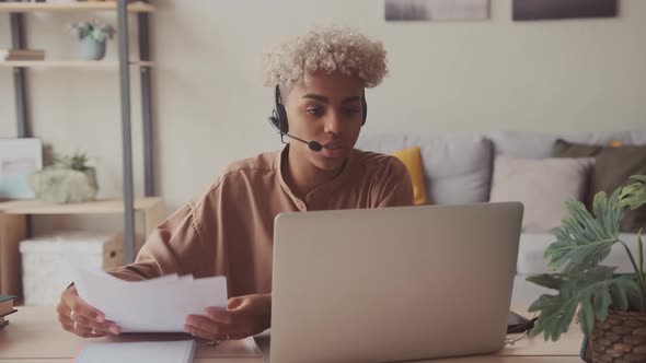 Afro Woman Wear Headset Talking with Client Online