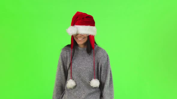Shot of a Charming Santa Claus Girl Having Fun at Studio