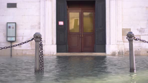 External Door of a Building Flooded with Water