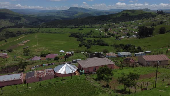 Drone shot of the Transkei in South Africa - drone is flying over some traditional houses. Snippet c