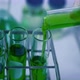 Scientist is preparation the green chemical solution in test tube in the laboratory experiment. - VideoHive Item for Sale