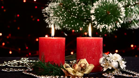Two Red Candles with Christmas Decorations and Tree on Black, Bokeh, Light, Garland