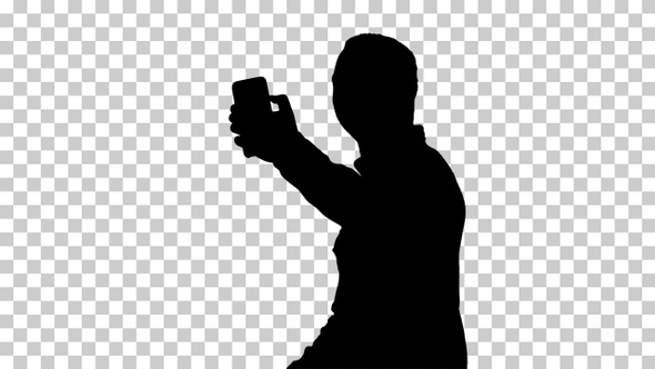 Silhouette Teenage boy making a selfie when walking, Alpha Channel