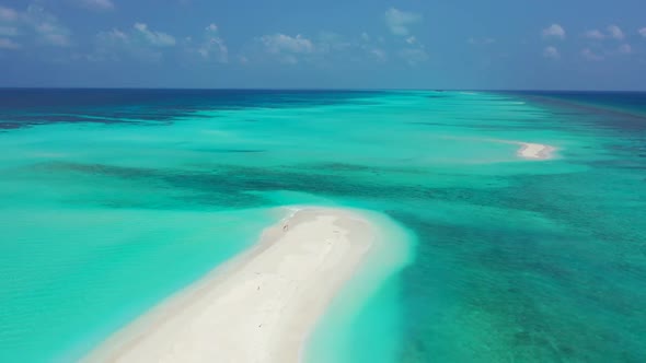 Aerial drone view texture of idyllic sea view beach holiday by blue water and clean sandy background