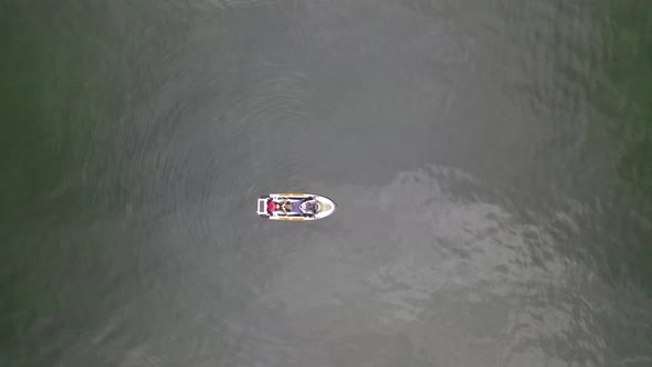 Aerial view of aa person on a speedboat on Unalaska island, United States.