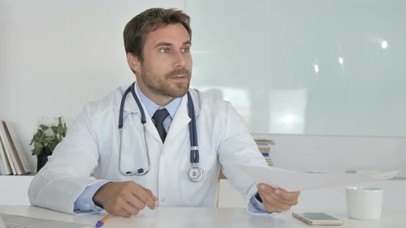 Doctor Sharing Medical Report with Patient, Giving Documents
