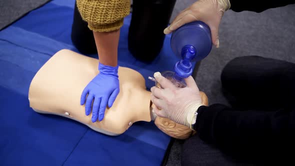 Practicing first aid on mannequin