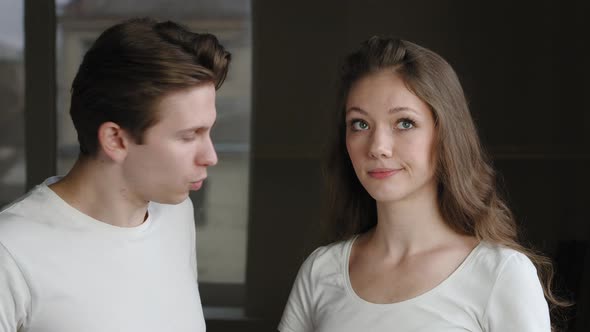 Portrait of Caucasian Couple Friends Girlfriend and Boyfriend Talking Standing Indoors