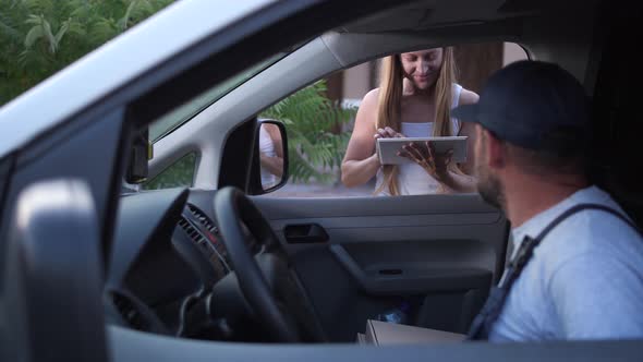 Female Confirming Pizza Delivery on Tablet Outdoor