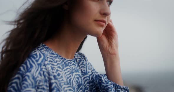 A Young Woman Takes Out Wireless Headphones From Box and Puts Them in Her Ears