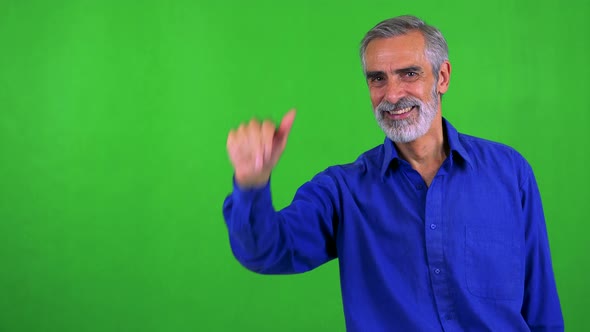 Old Senior Man Waves with Hand - Green Screen - Studio