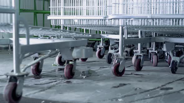 Man Puts the Cart in the Supermarket Closeup