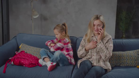 Busy with Phone Mother Ignoring Upset Girl Indoor