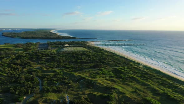 Flying over the Gold Coast spit at sunrise, views of South Stradbroke and golden beaches