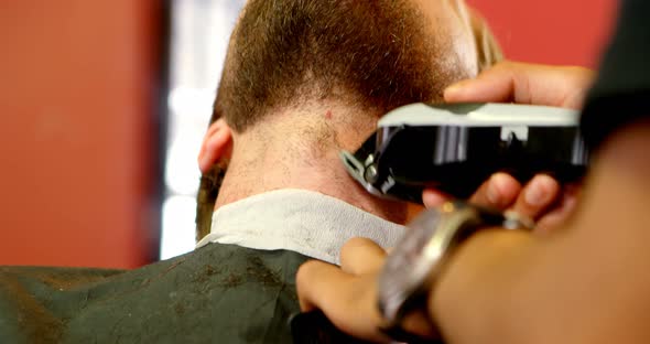 Man Getting His Beard Trimmed with Trimmer 4k