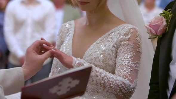 Bride and Groom Exchange Wedding Rings at Ceremony