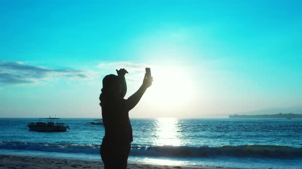 Sexy smiling girl on vacation spending quality time at the beach on sunny blue and white sand 4K bac