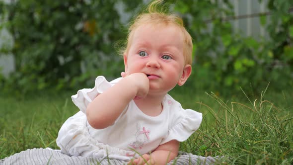 Teeth are cutting through. Baby teething background. Baby teething problems. Finger in mouth.